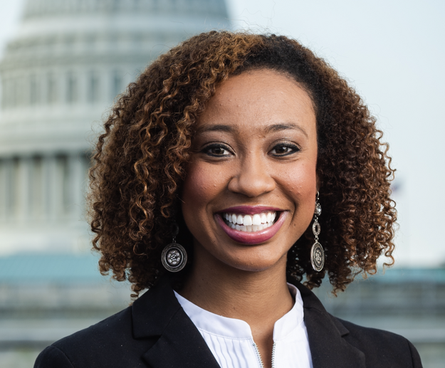 Headshot of a young black woman in business attire.